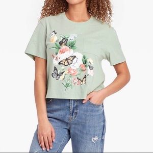Zoe + Liv light green shirt with butterflies and flowers.